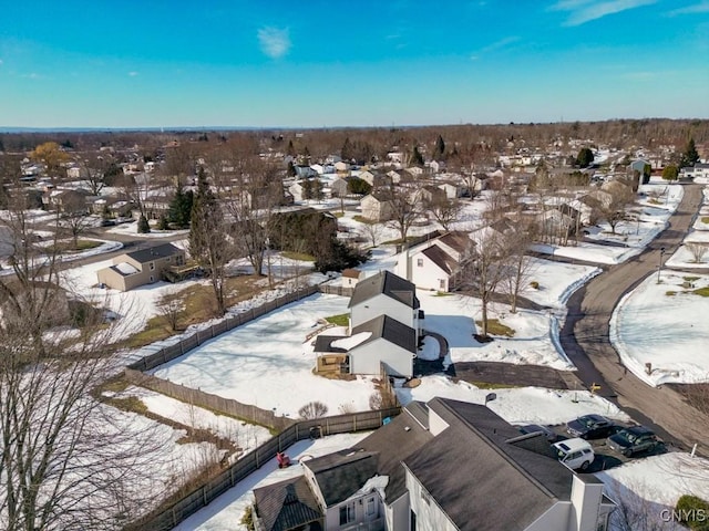 snowy aerial view featuring a residential view