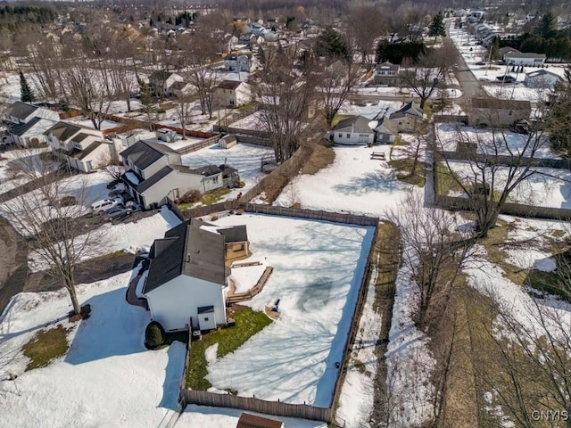 snowy aerial view featuring a residential view