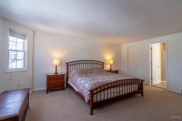 carpeted bedroom with baseboards