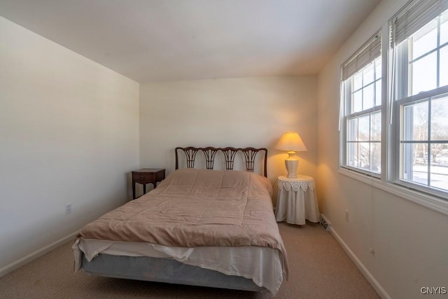 bedroom featuring visible vents, baseboards, and carpet flooring