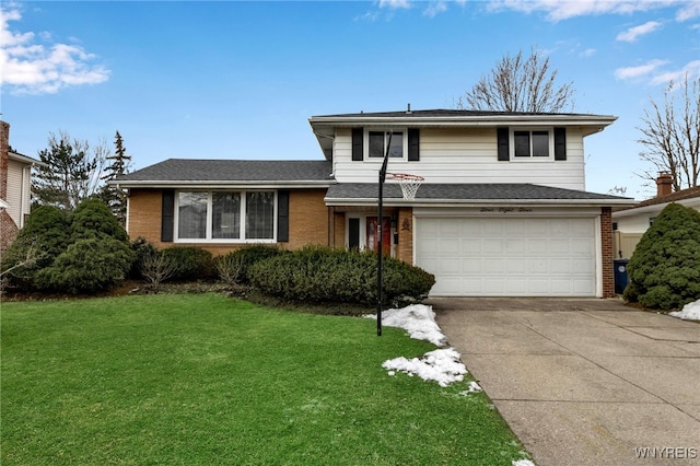 split level home featuring brick siding, a garage, driveway, and a front yard