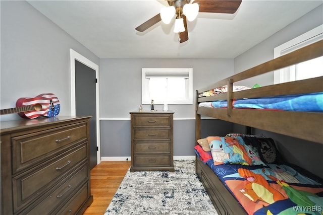 bedroom with light wood finished floors and ceiling fan