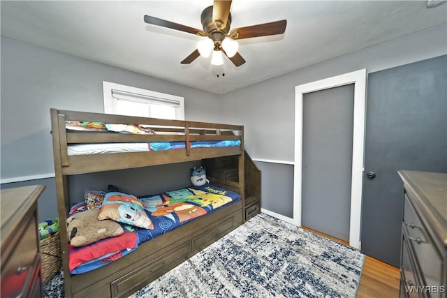 bedroom featuring ceiling fan and wood finished floors