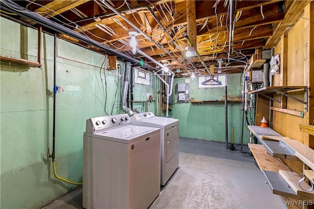 washroom featuring separate washer and dryer and laundry area