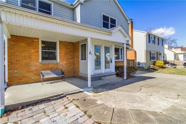 exterior space featuring brick siding