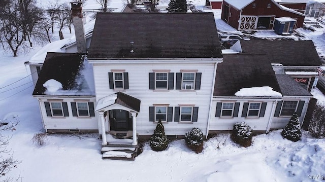 view of front of house with a garage and a chimney