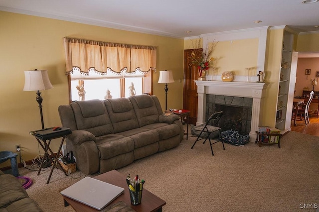 living room featuring a tile fireplace, crown molding, and carpet floors