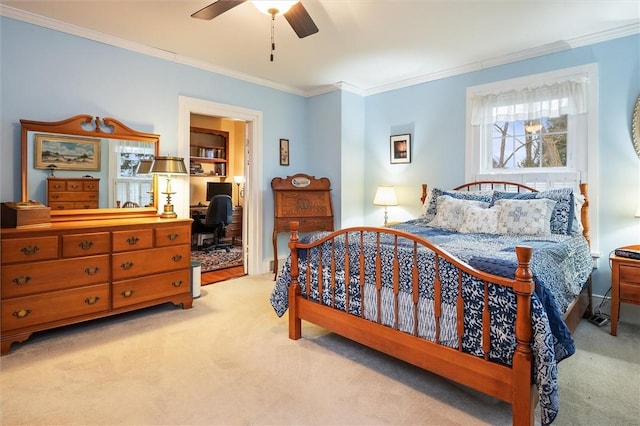 bedroom with carpet flooring, a ceiling fan, and ornamental molding