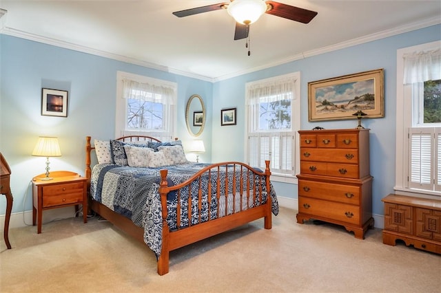 bedroom with multiple windows, crown molding, and carpet floors