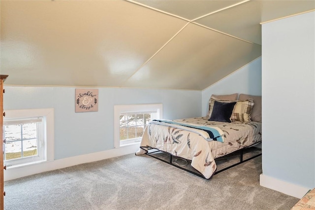 bedroom featuring vaulted ceiling and carpet floors