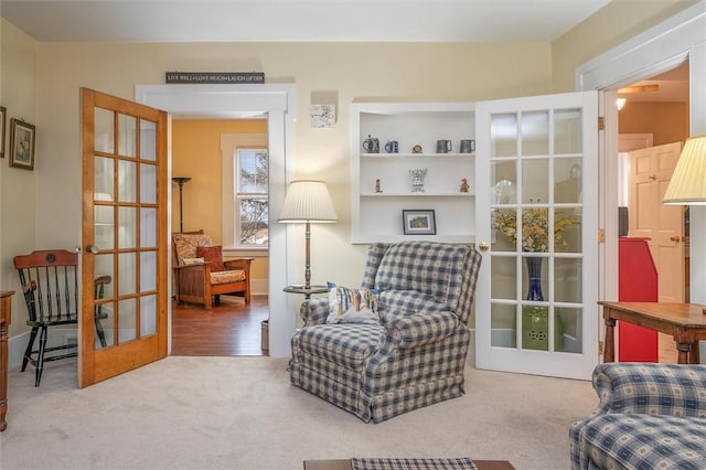 sitting room with french doors and carpet