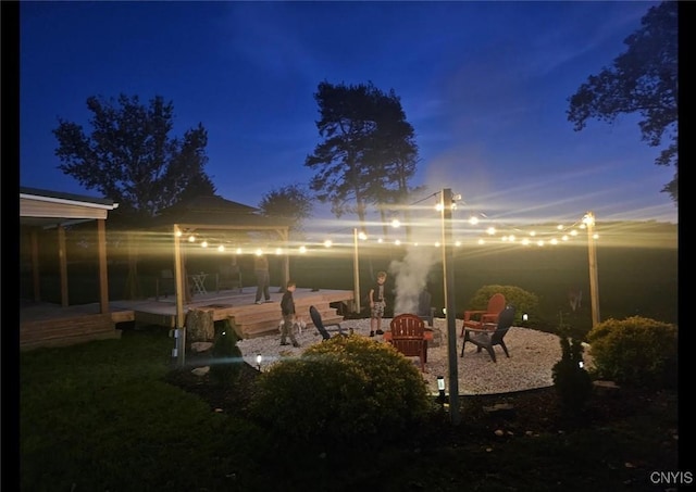 view of yard with an outdoor fire pit