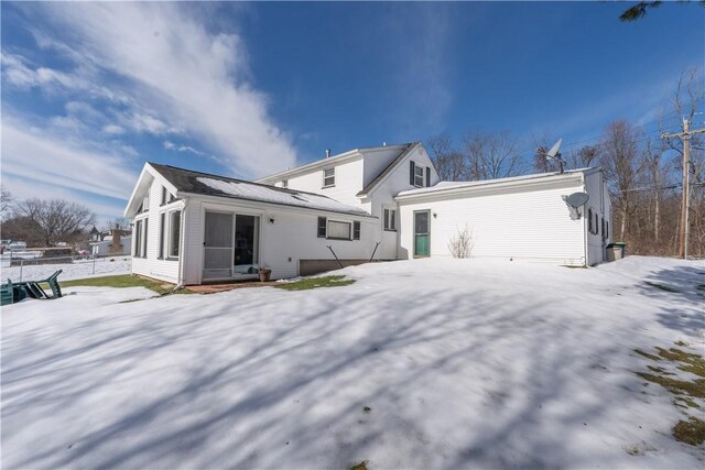 view of snow covered house