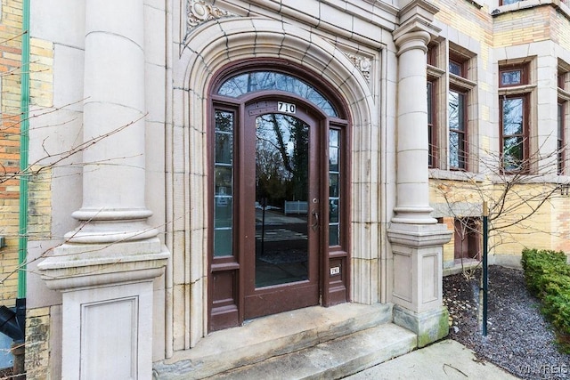 entrance to property with stone siding