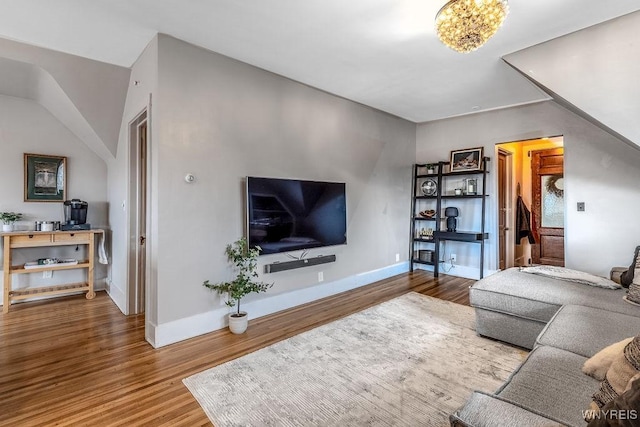 living room with baseboards and wood finished floors