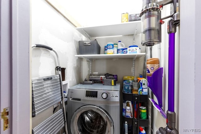 laundry area featuring washer / dryer and laundry area