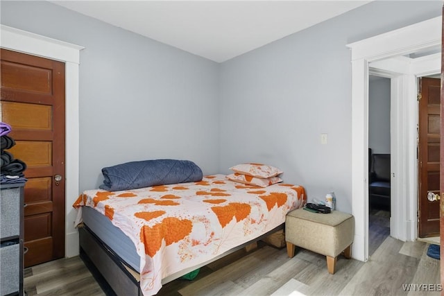 bedroom featuring wood finished floors