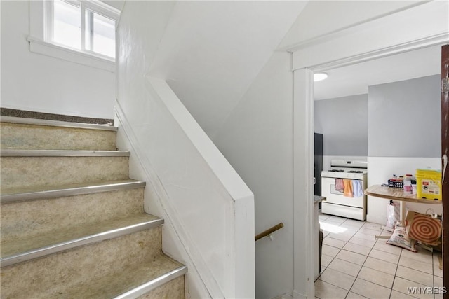 stairs with tile patterned floors