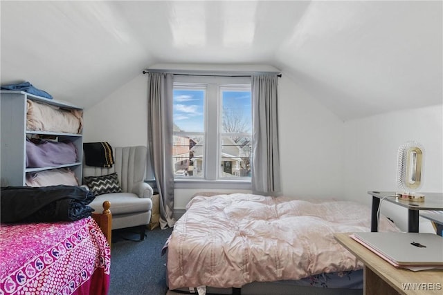 carpeted bedroom featuring lofted ceiling