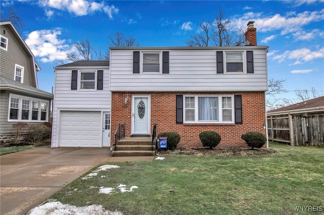 view of front of property featuring driveway, brick siding, a chimney, and a front lawn