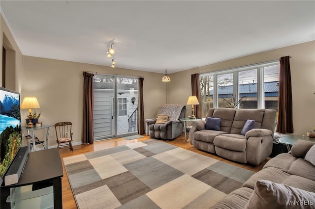 living room with light wood-style floors and baseboards