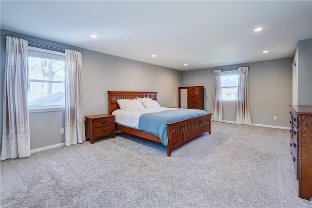 carpeted bedroom featuring recessed lighting and baseboards