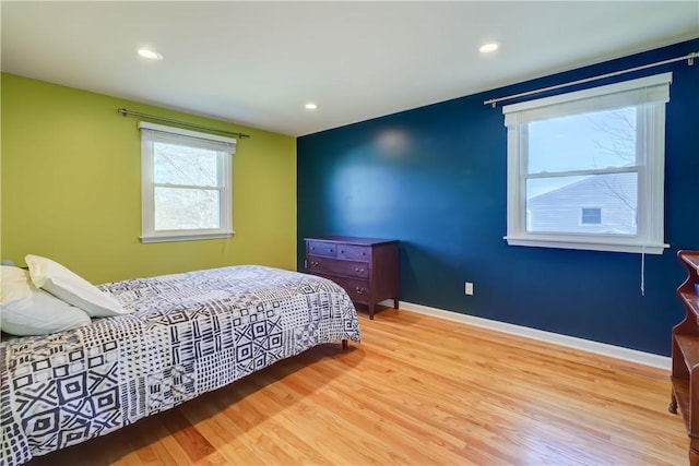 bedroom featuring recessed lighting, wood finished floors, and baseboards