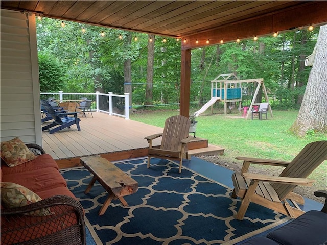 view of patio featuring a deck and a playground