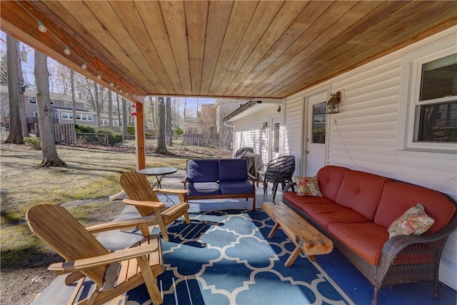 view of patio / terrace with outdoor lounge area and fence