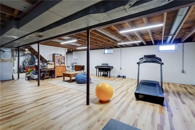 exercise room featuring wood finished floors