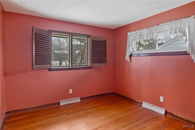 spare room with plenty of natural light, baseboards, and visible vents