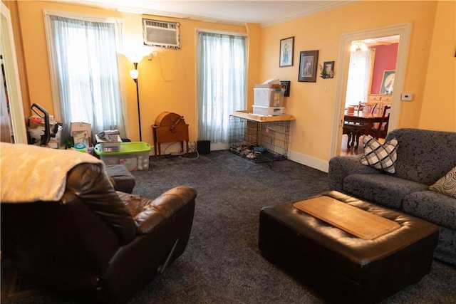 living area with carpet flooring, a wall mounted air conditioner, baseboards, and ornamental molding