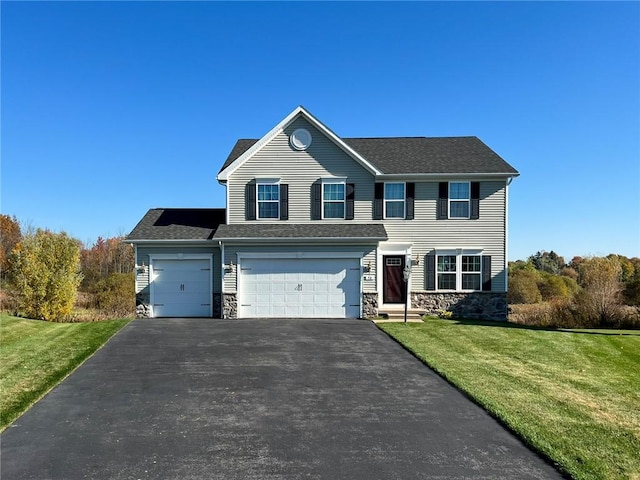 view of front of house with a front lawn, a garage, stone siding, and aphalt driveway