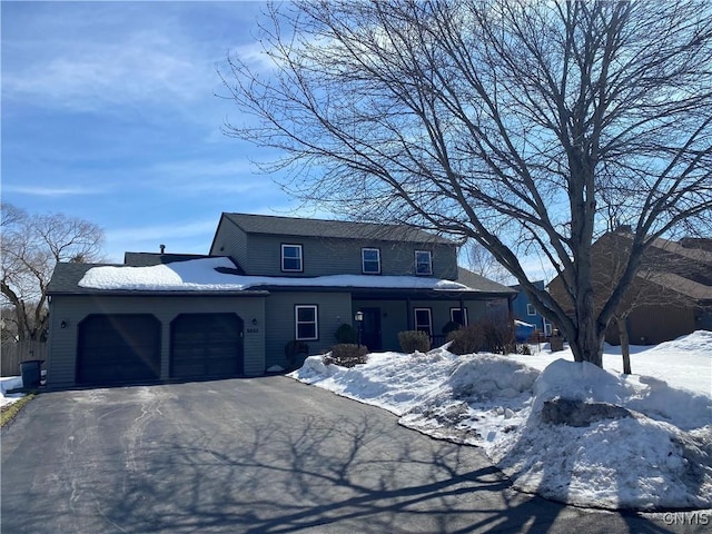 view of front of property featuring driveway and a garage