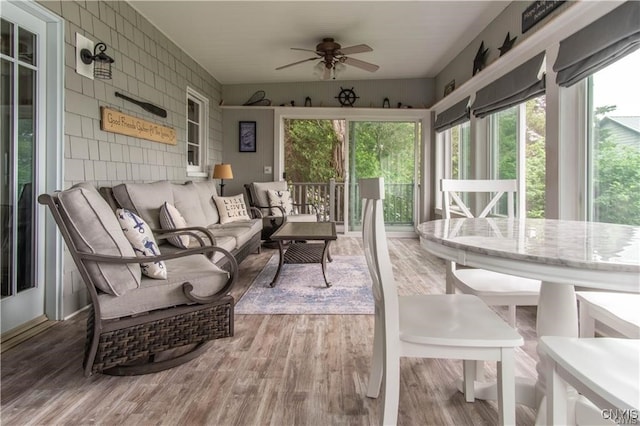 sunroom with plenty of natural light and ceiling fan