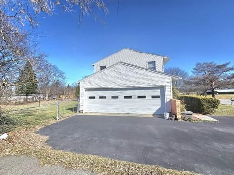 view of home's exterior featuring driveway