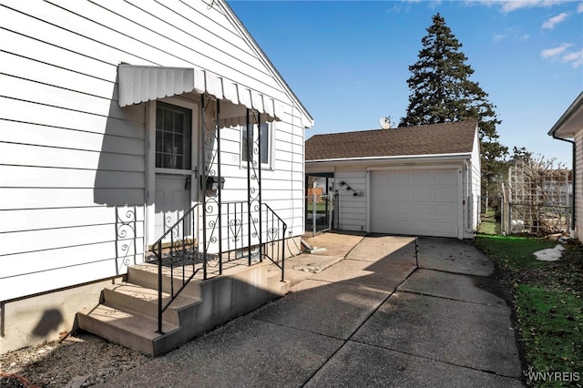 entrance to property with a garage and driveway