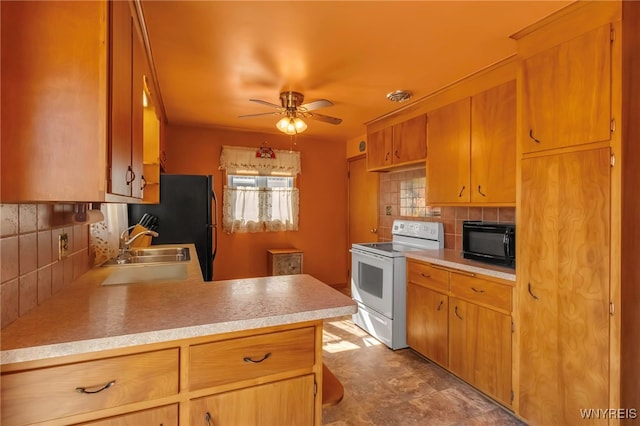 kitchen featuring white range with electric stovetop, backsplash, light countertops, and black microwave