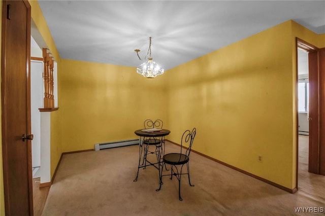 unfurnished dining area featuring baseboard heating, carpet, and baseboards