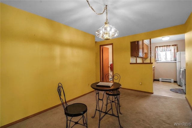 unfurnished dining area featuring light carpet, a baseboard heating unit, and baseboards