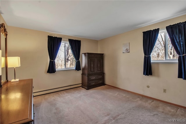 unfurnished bedroom with carpet floors, baseboards, and a baseboard radiator