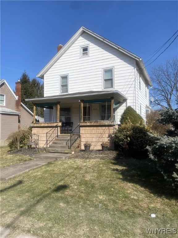 view of front of property featuring a porch and a chimney