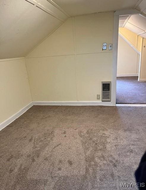 bonus room featuring heating unit, lofted ceiling, carpet flooring, and baseboards