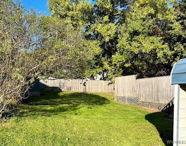 view of yard featuring fence