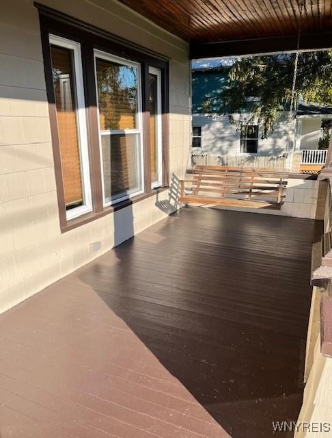 wooden deck featuring covered porch