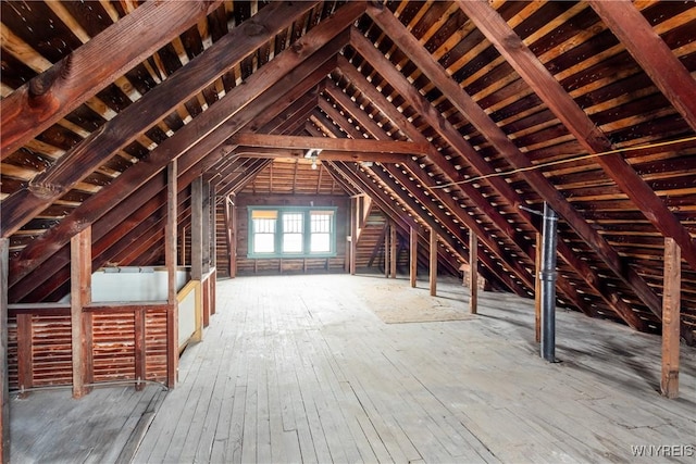 attic featuring an upstairs landing