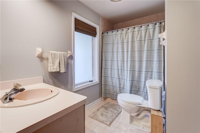 bathroom featuring tile patterned flooring, a shower with shower curtain, toilet, and vanity