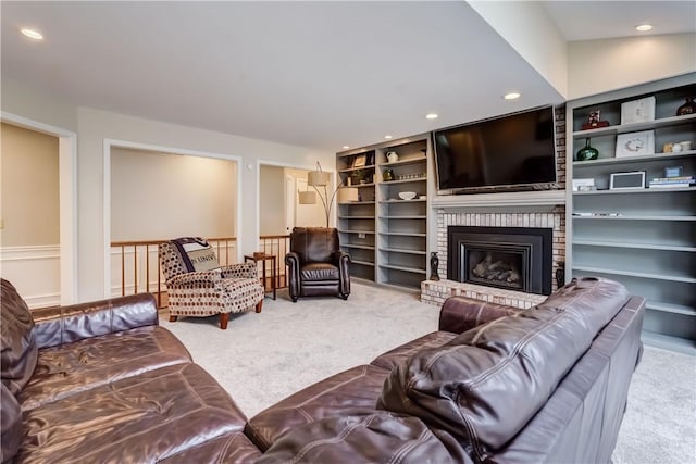 living area with a brick fireplace, carpet flooring, recessed lighting, and built in features