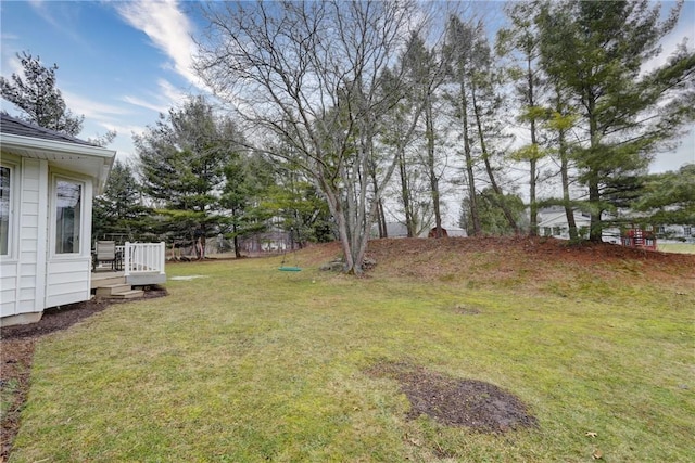 view of yard featuring a wooden deck