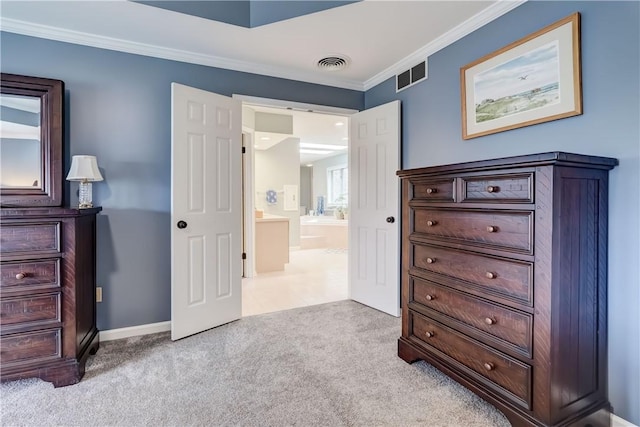 bedroom with visible vents, baseboards, carpet flooring, and crown molding